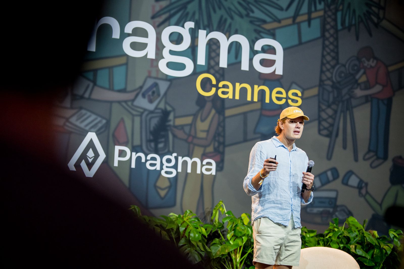 Envio speaker on stage presenting at Pragma Cannes